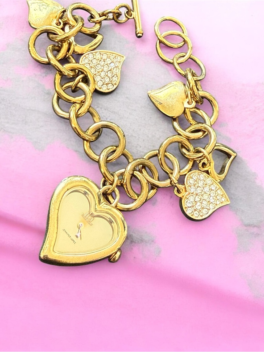 Pre-owned Jennifer Lopez women gold tone heart bracelet analog quartz watch